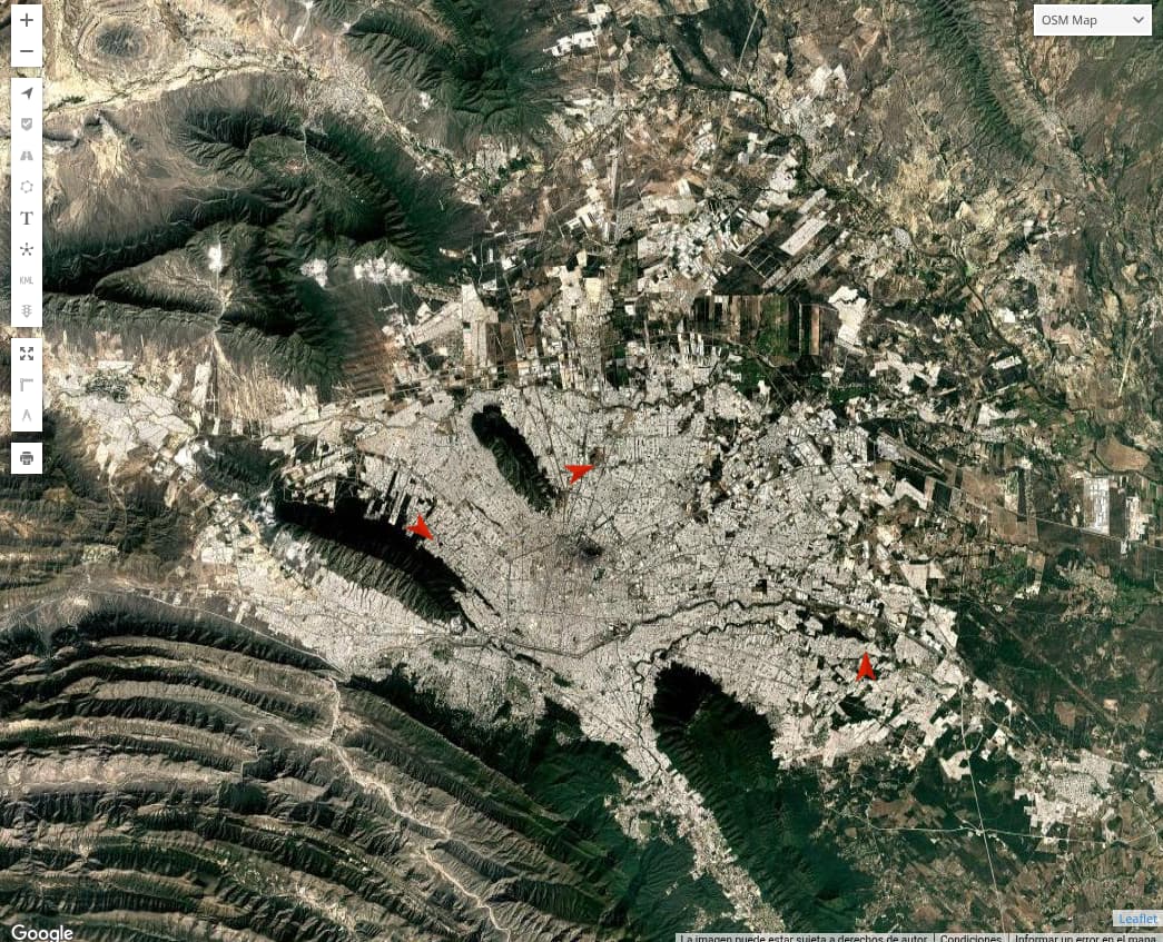 Vista satelital del mapa con varias unidades de la flota ubicadas como marcadores, sin etiquetas de nombre ni placas.